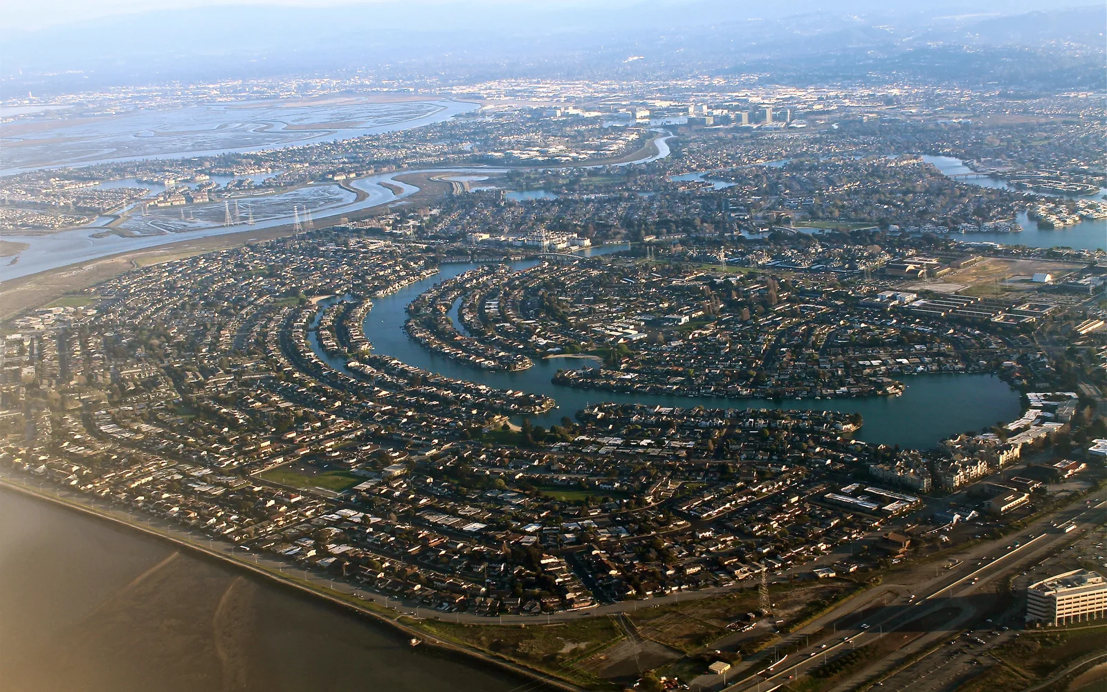 Aerial view of Silicon Valley showing technology campuses, corporate headquarters buildings, and innovation centers