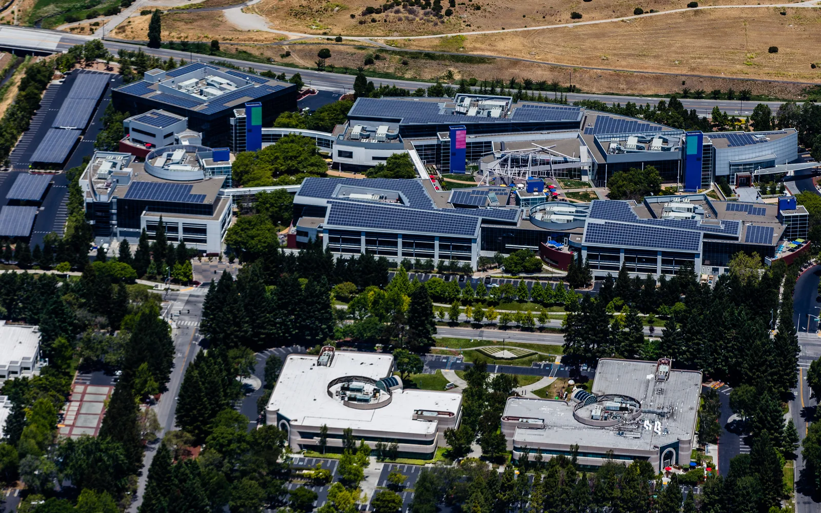 Google Googleplex headquarters campus buildings in Mountain View with landscaped grounds